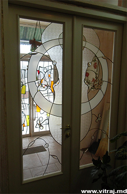 Stained glass in doors with faceted elements