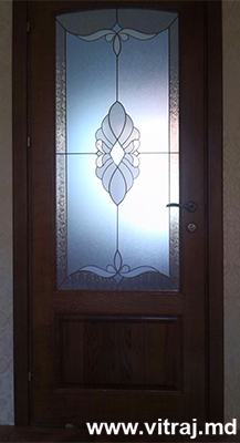 Stained glass in door with faceted elements